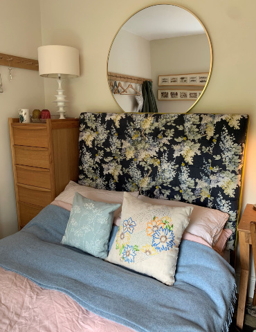 Bespoke linen double headboard with velvet trim.